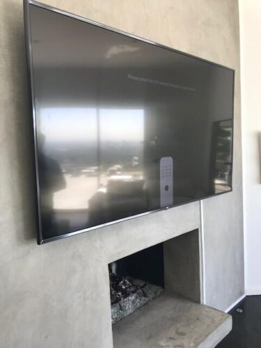 TV on wall concrete